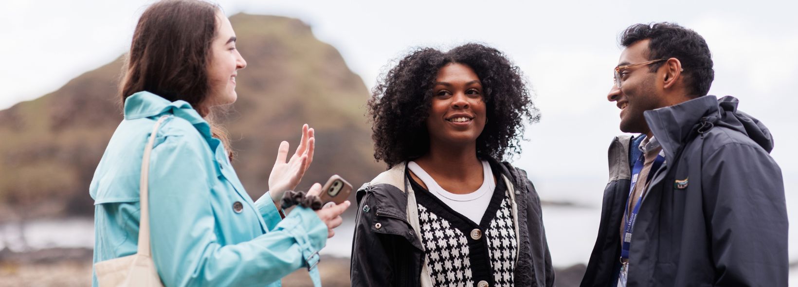 Three Fulbright students chatting at Giant's Causeway in Northern Ireland