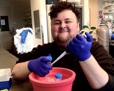 PhD student Yoldas in a science lab at Loyola University in Chicago